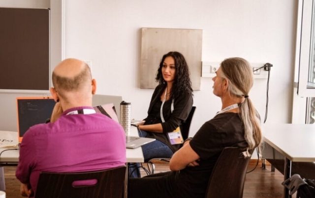 Our doctoral student Cansu Demir can be seen in the center of the picture. To her left and right are two men attending the conference.